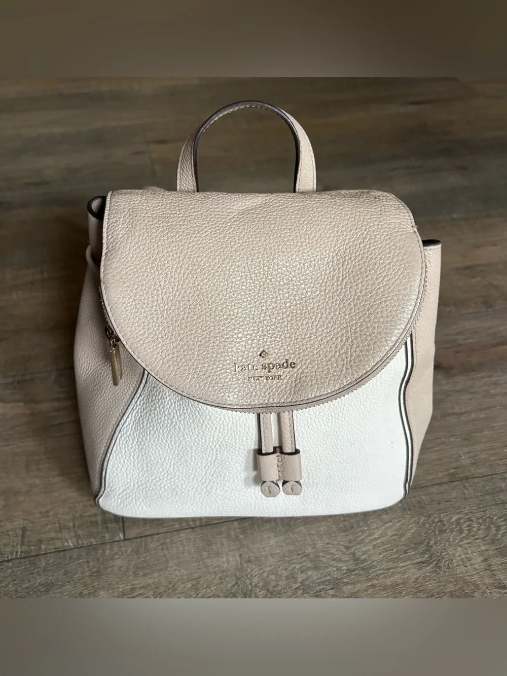 Kate Spade women’s Leila Medium Flap Backpack beige cream pebbled leather purse